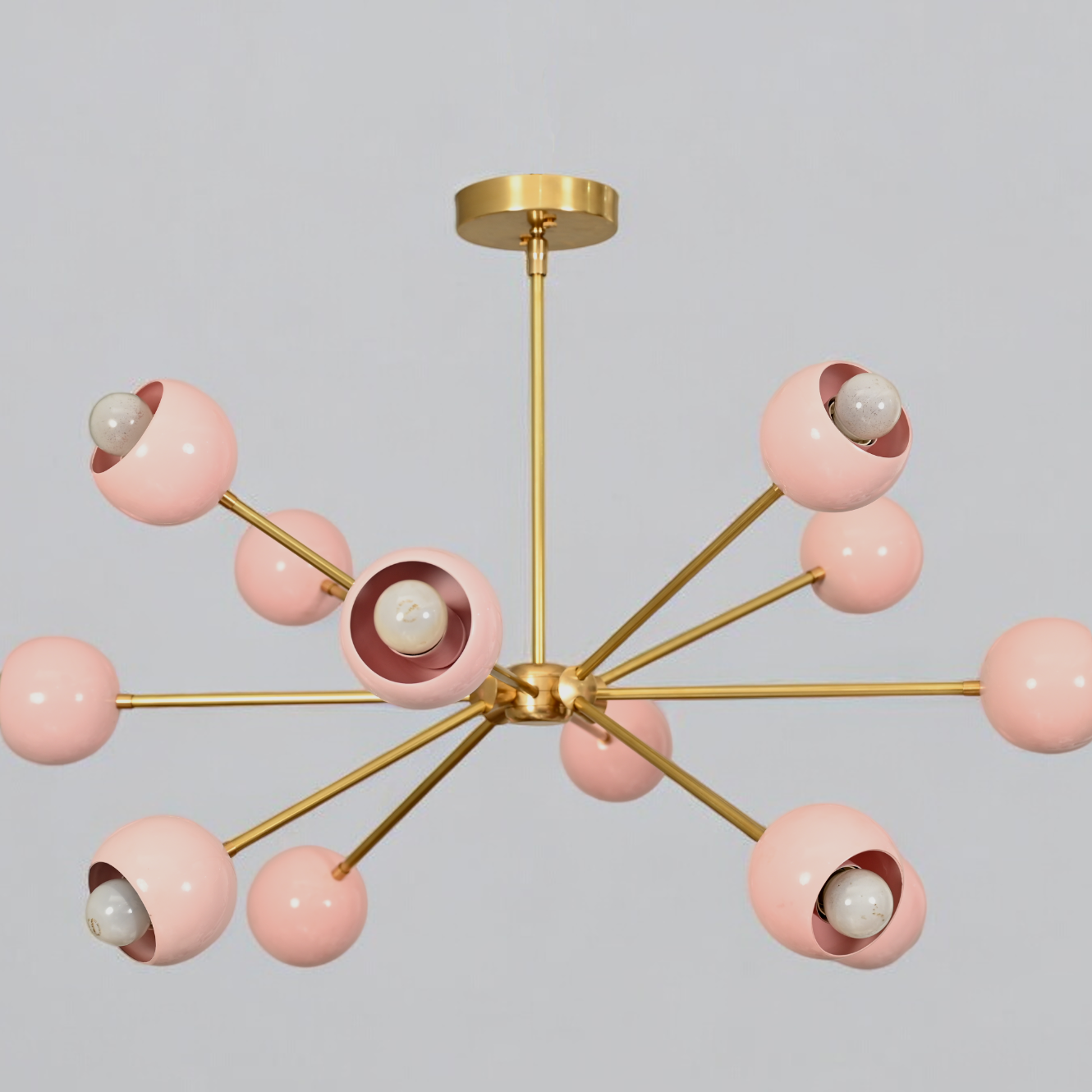 Elegant twelve-arm light pink Sputnik chandelier, a vibrant mid-century starburst fixture