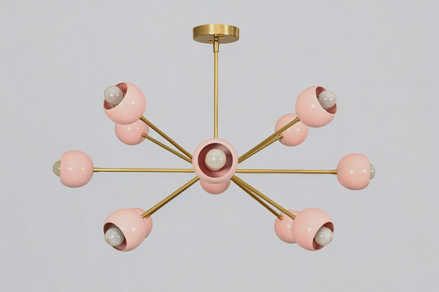 Elegant twelve-arm light pink Sputnik chandelier, a vibrant mid-century starburst fixture