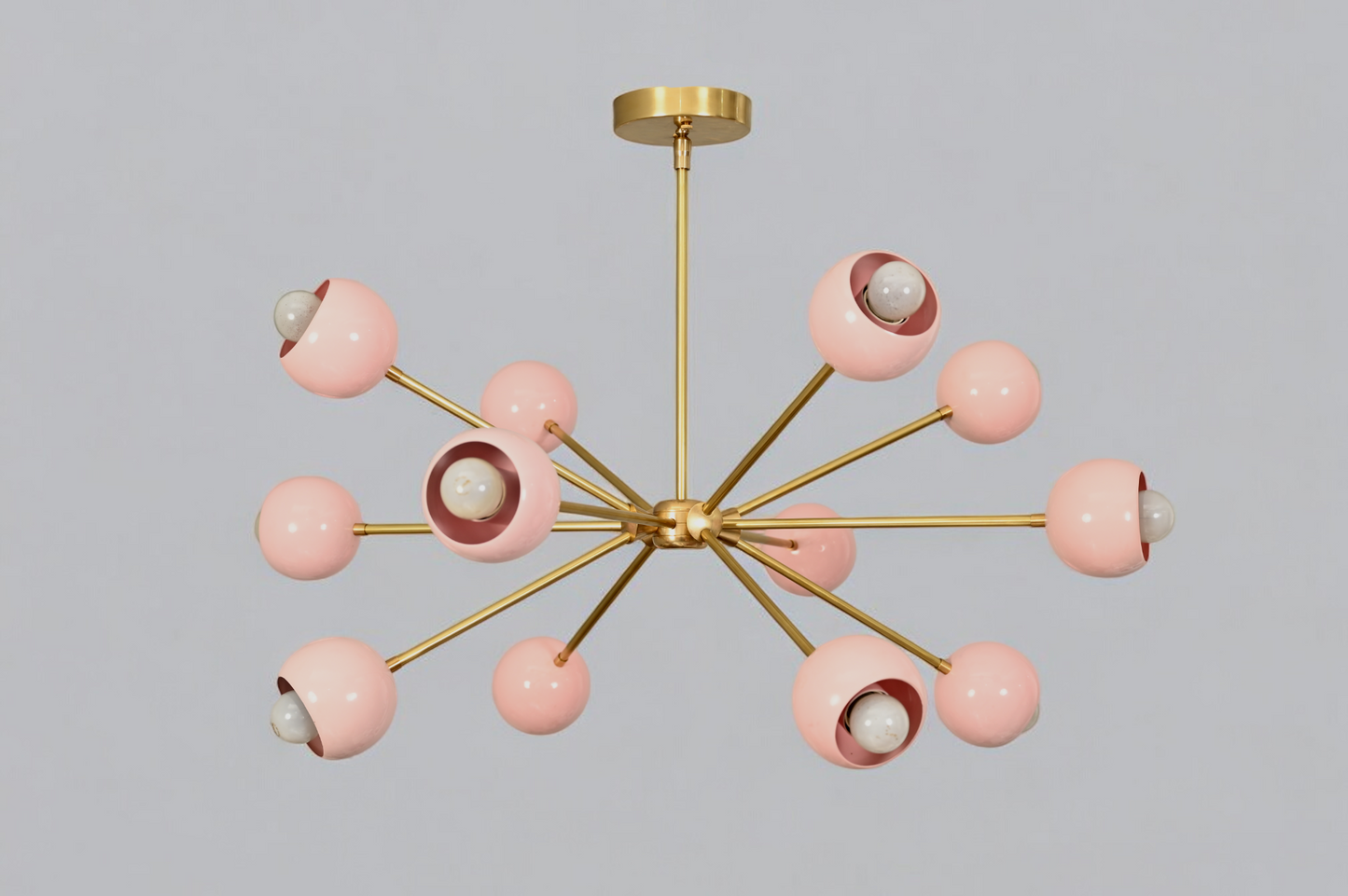 Elegant twelve-arm light pink Sputnik chandelier, a vibrant mid-century starburst fixture