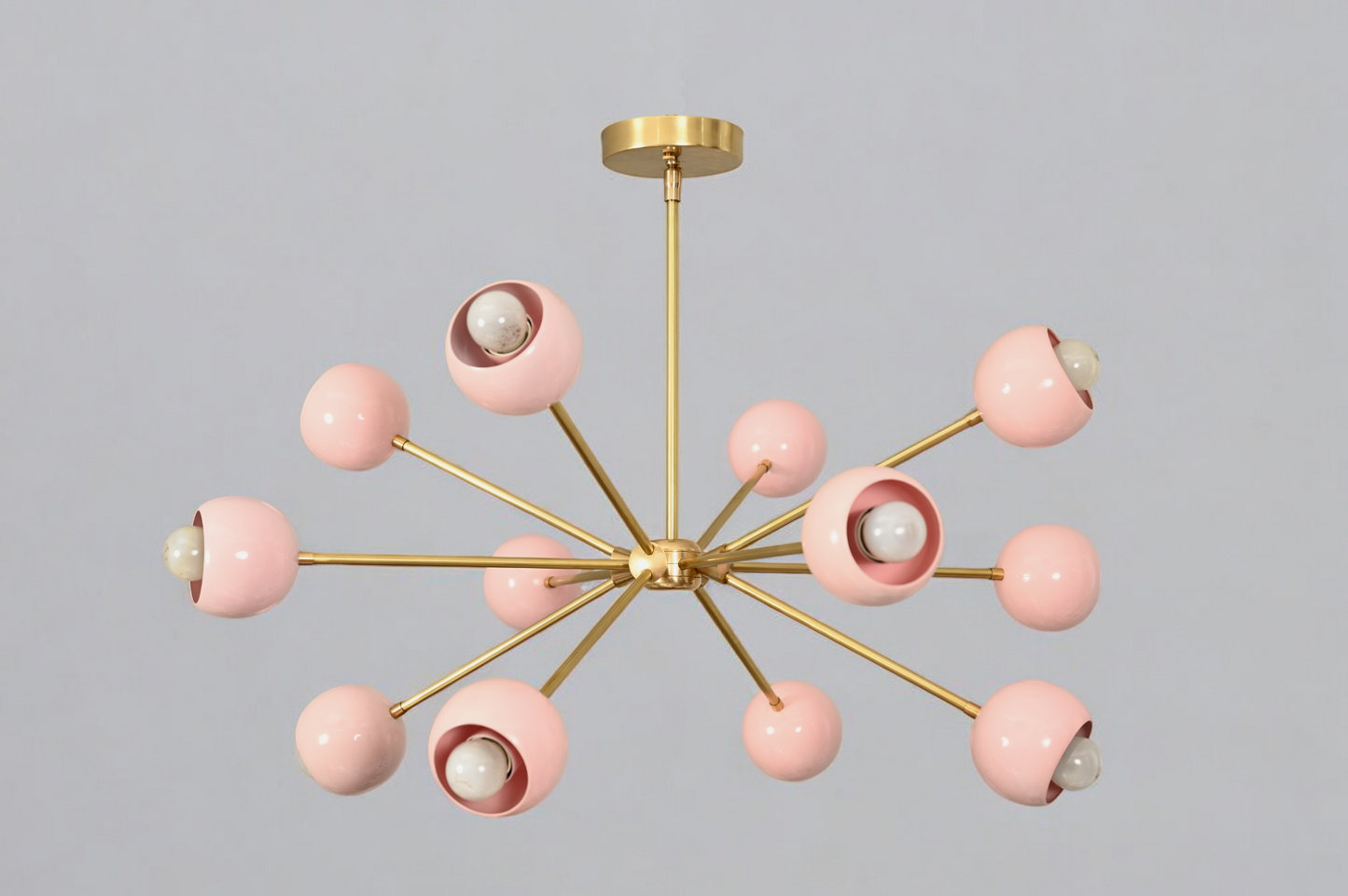 Elegant twelve-arm light pink Sputnik chandelier, a vibrant mid-century starburst fixture