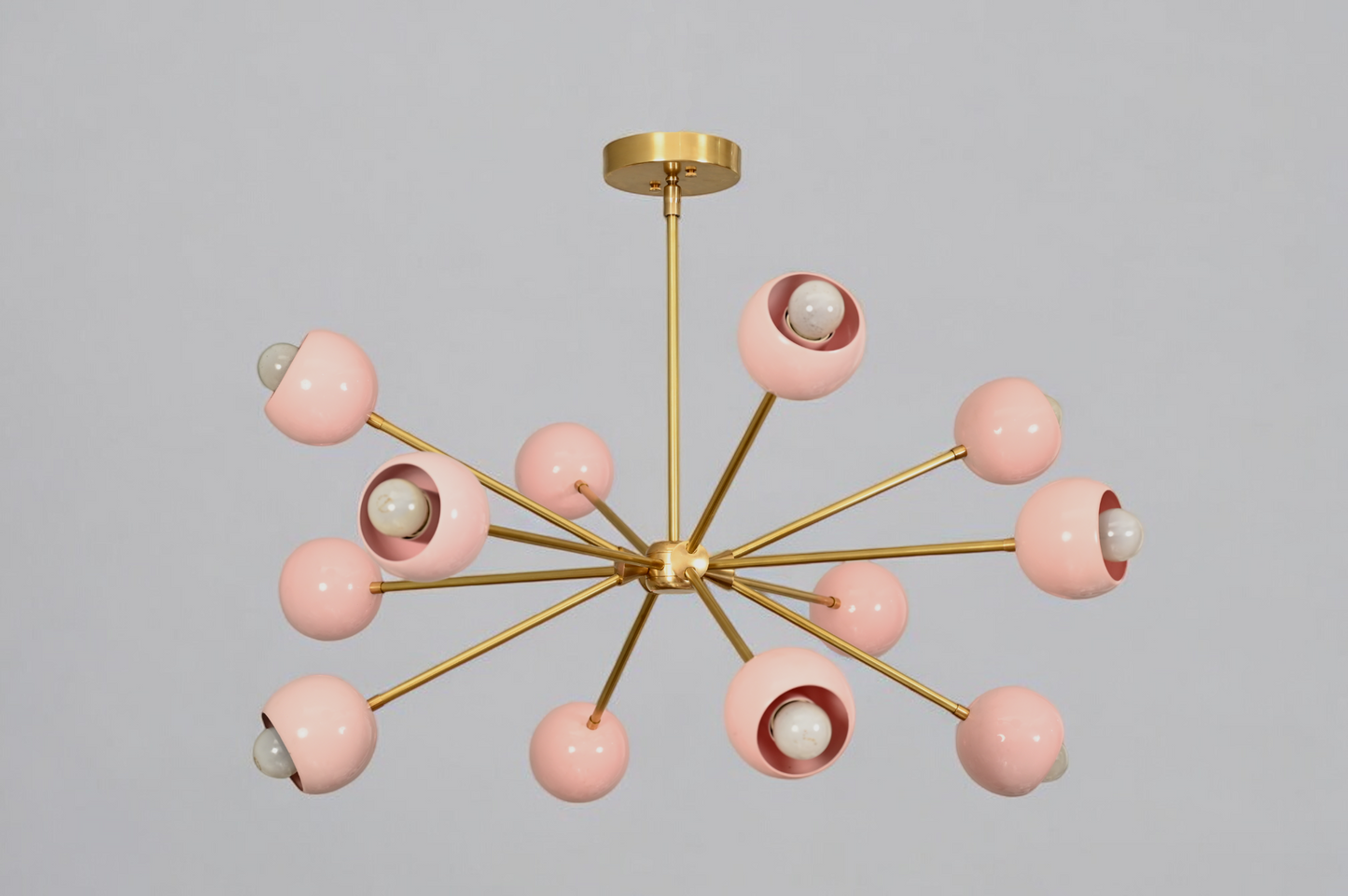 Elegant twelve-arm light pink Sputnik chandelier, a vibrant mid-century starburst fixture