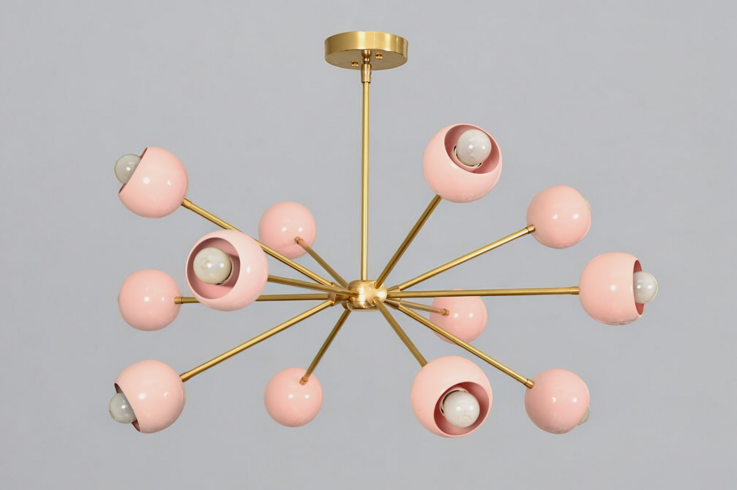 Elegant twelve-arm light pink Sputnik chandelier, a vibrant mid-century starburst fixture