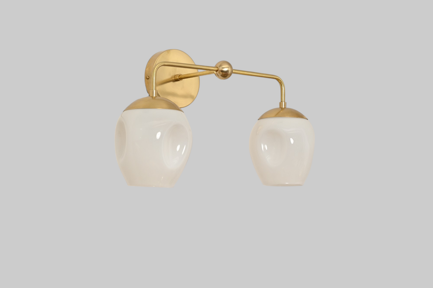 2-Light Dimple Globe Sconce: Raw brass, Mid-Century Modern, stylish ambient lighting