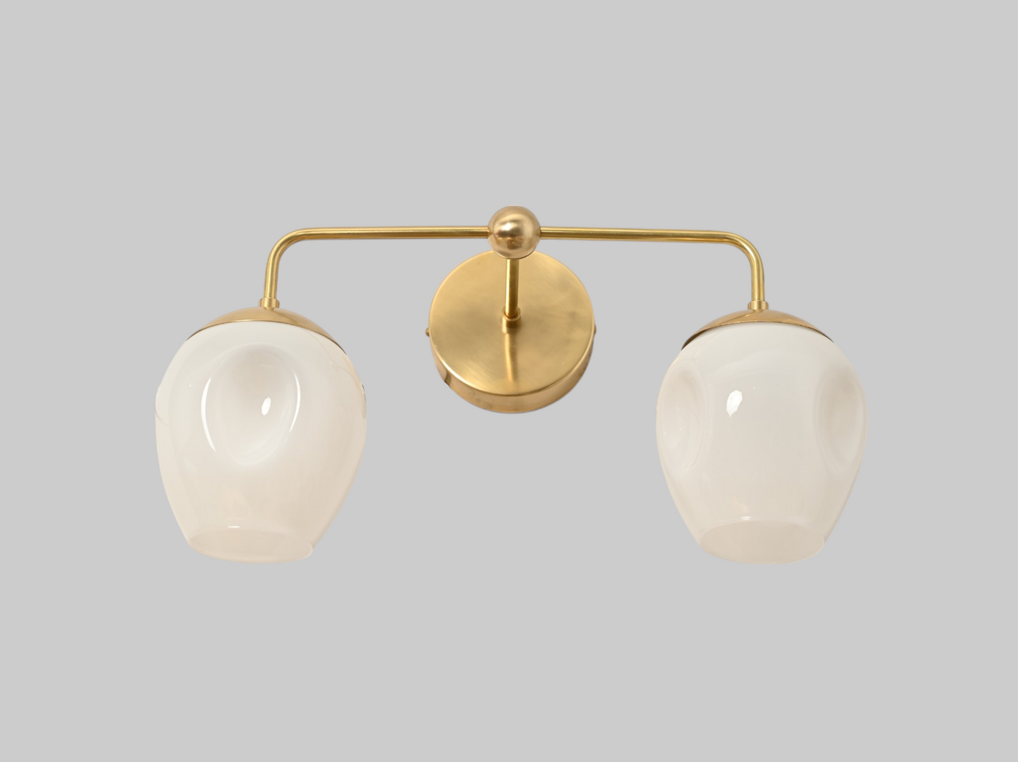 2-Light Dimple Globe Sconce: Raw brass, Mid-Century Modern, stylish ambient lighting