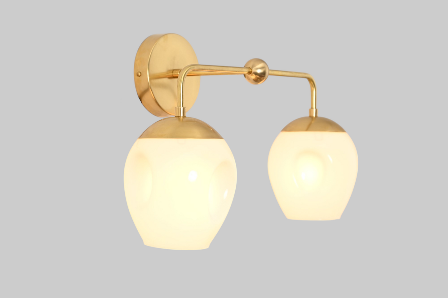 2-Light Dimple Globe Sconce: Raw brass, Mid-Century Modern, stylish ambient lighting