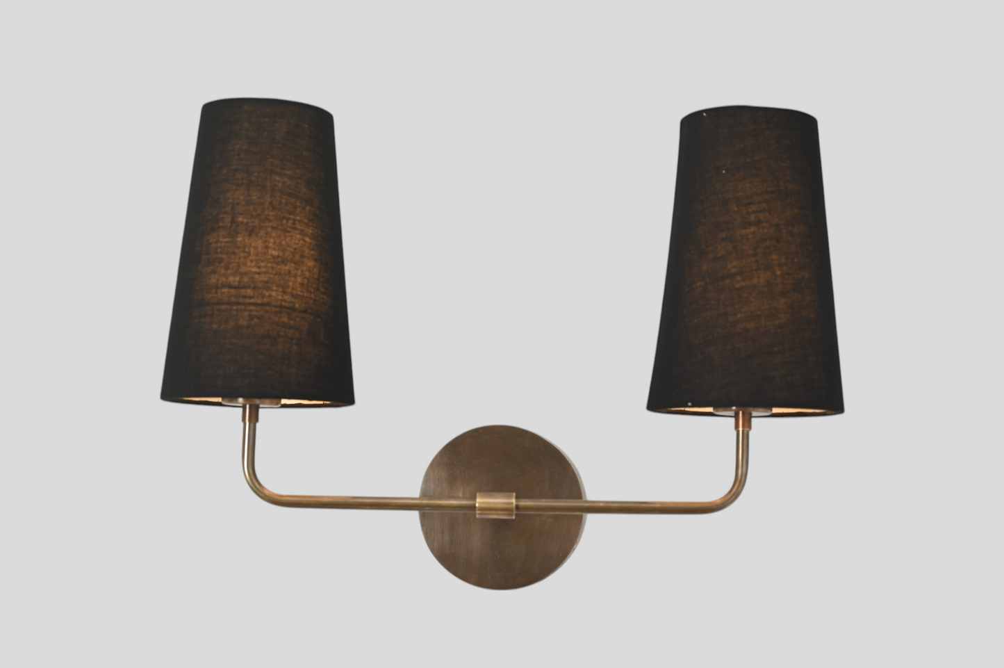 The 2 Shade Wall Lamp in black offers sleek, adjustable shades for modern lighting
