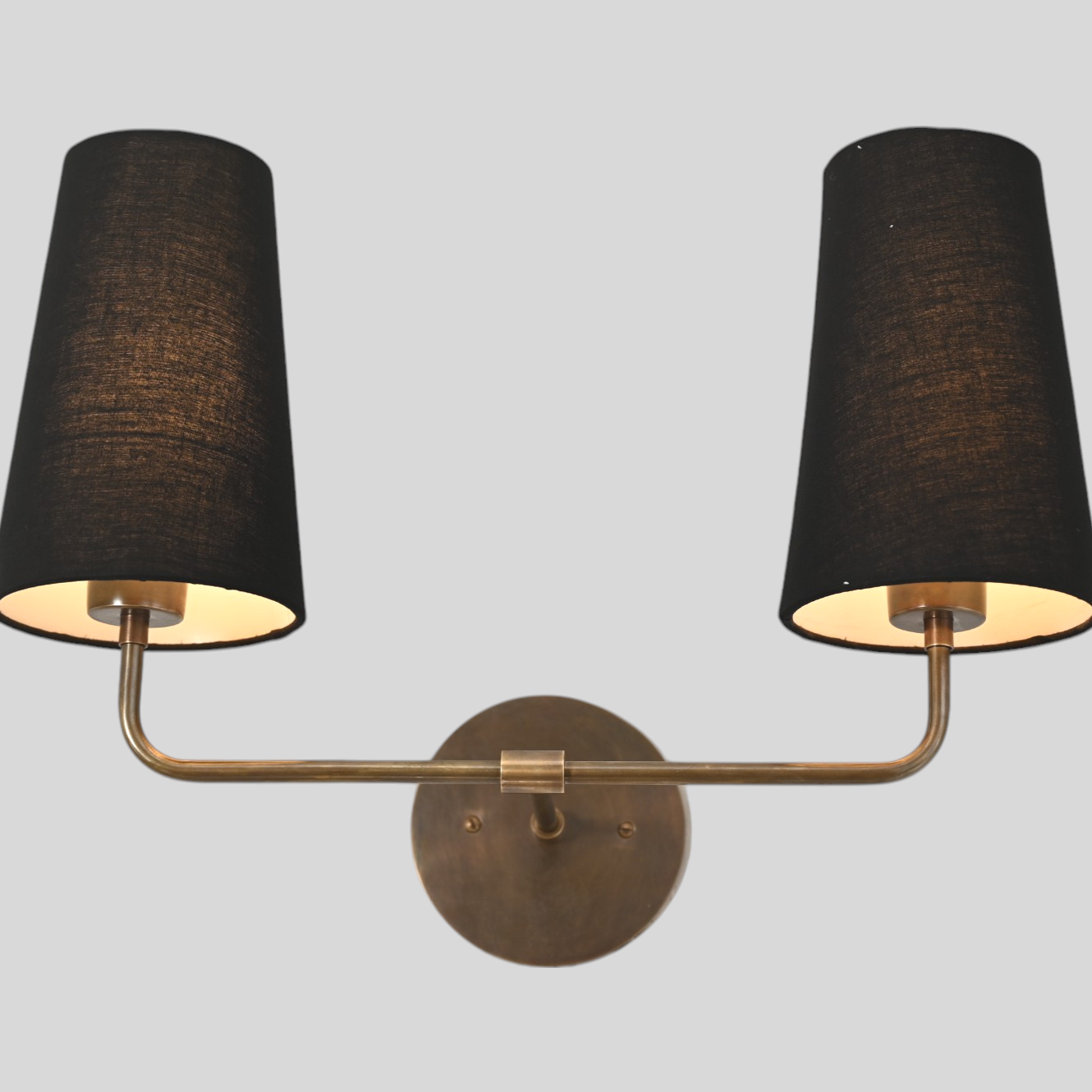 The 2 Shade Wall Lamp in black offers sleek, adjustable shades for modern lighting