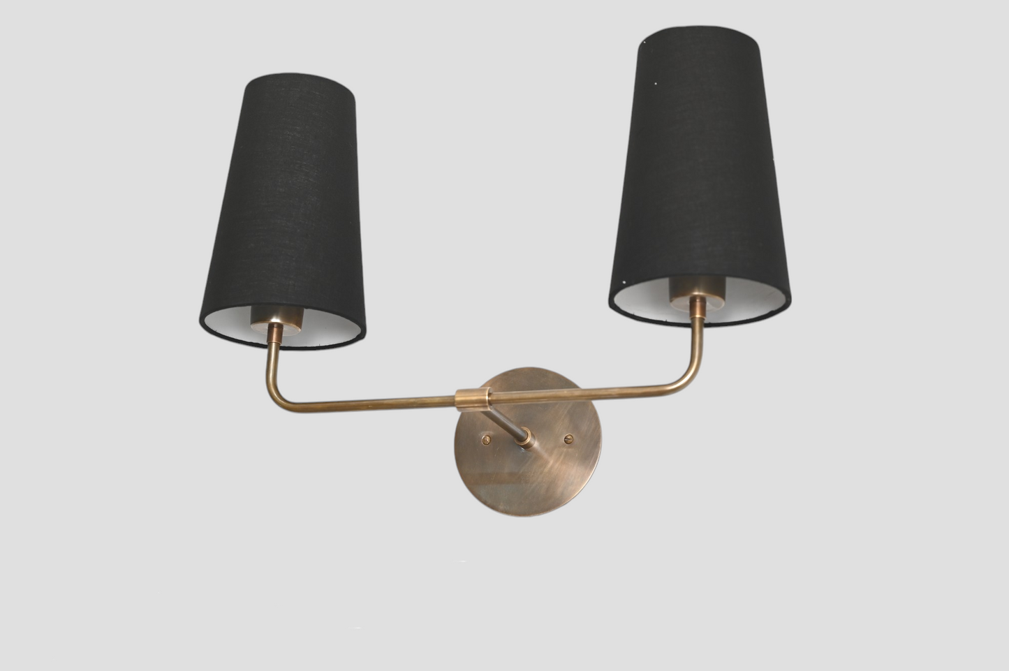 The 2 Shade Wall Lamp in black offers sleek, adjustable shades for modern lighting
