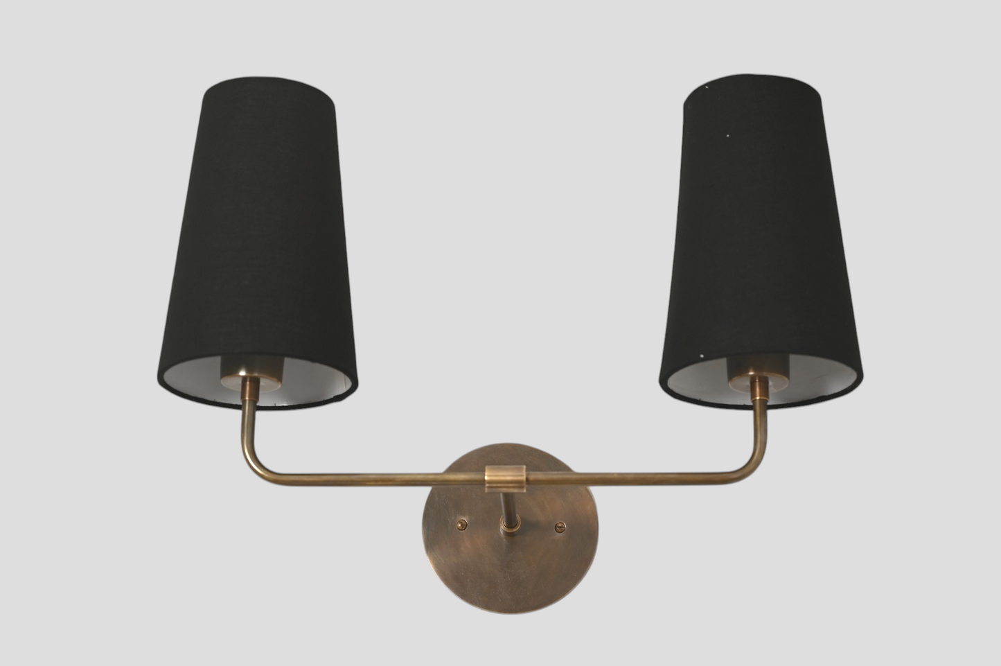 The 2 Shade Wall Lamp in black offers sleek, adjustable shades for modern lighting