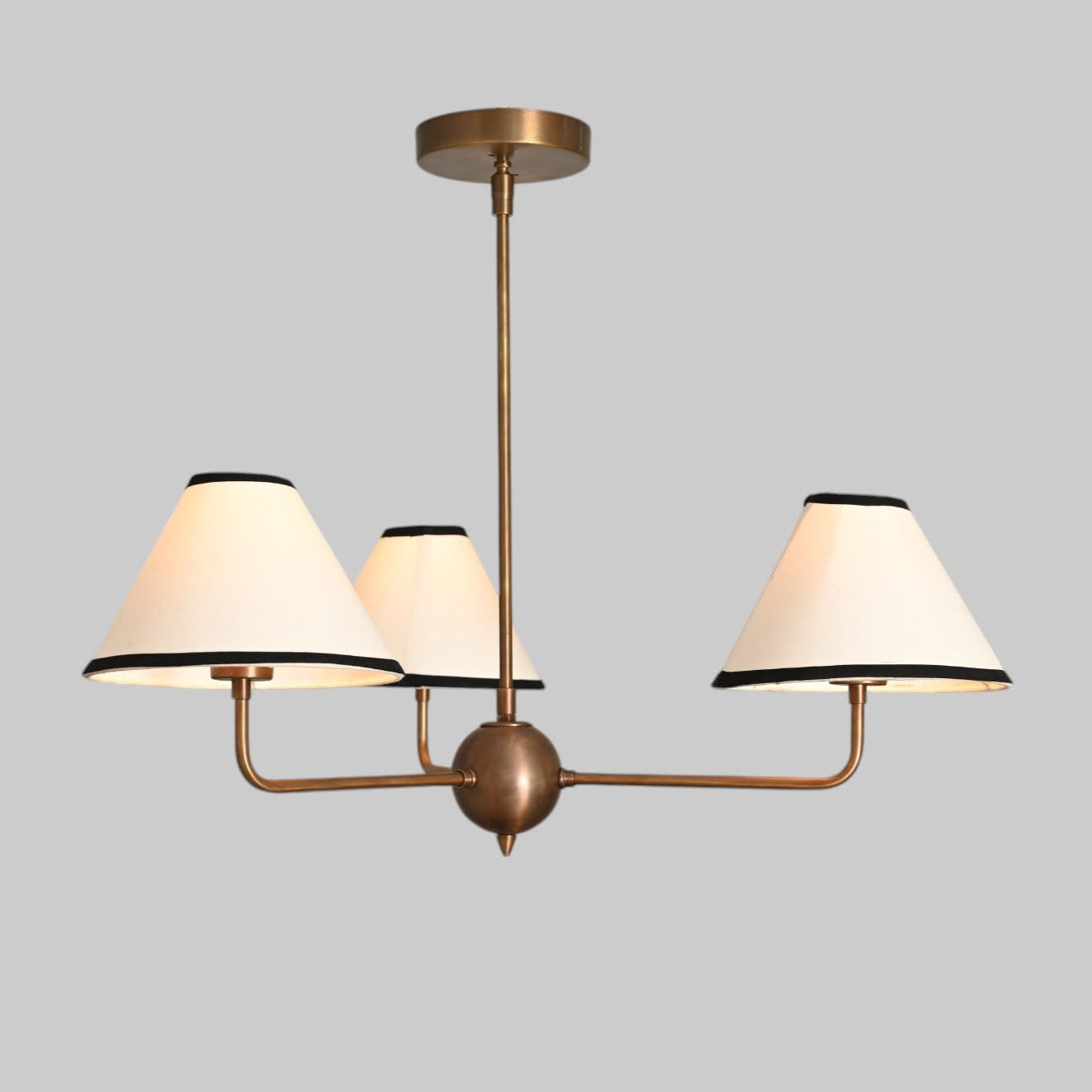 3-shade brass chandelier with unique finish variations for a one-of-a-kind design