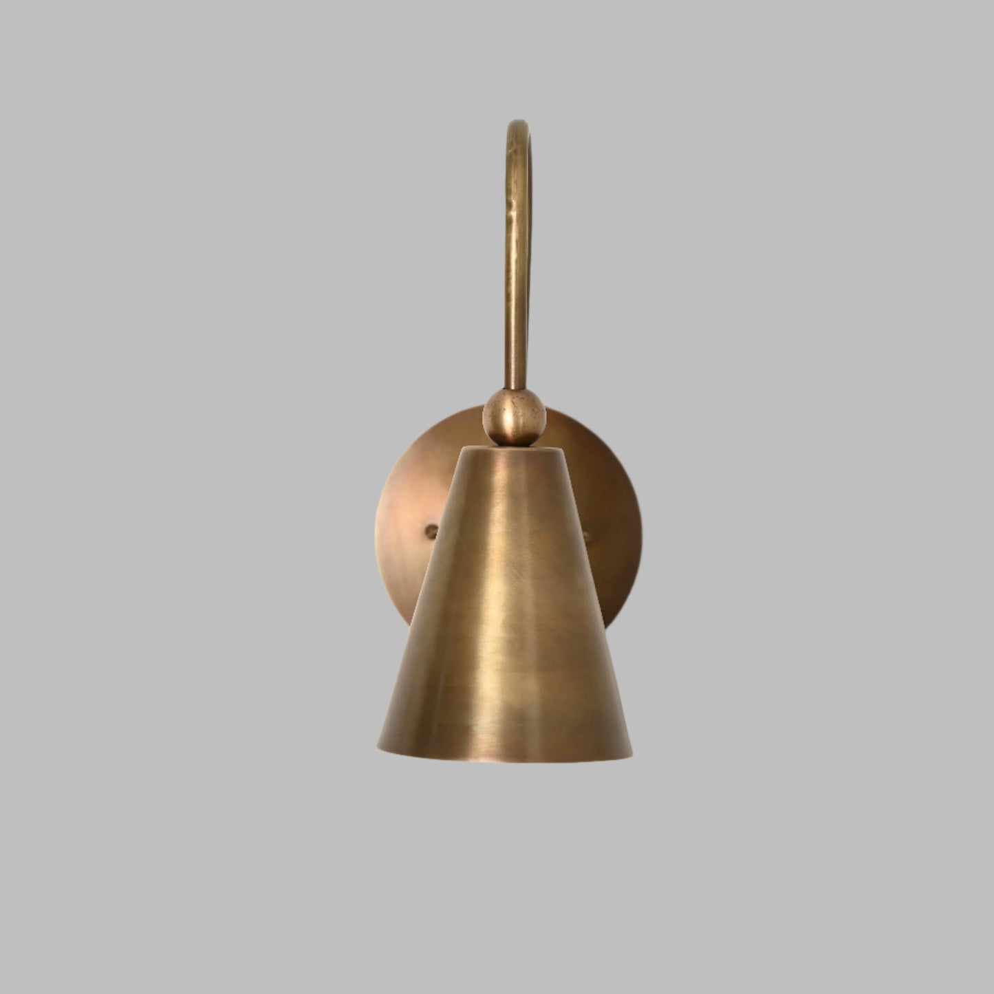 Mid-century modern wall sconces with raw brass finish and Sputnik design, adding style