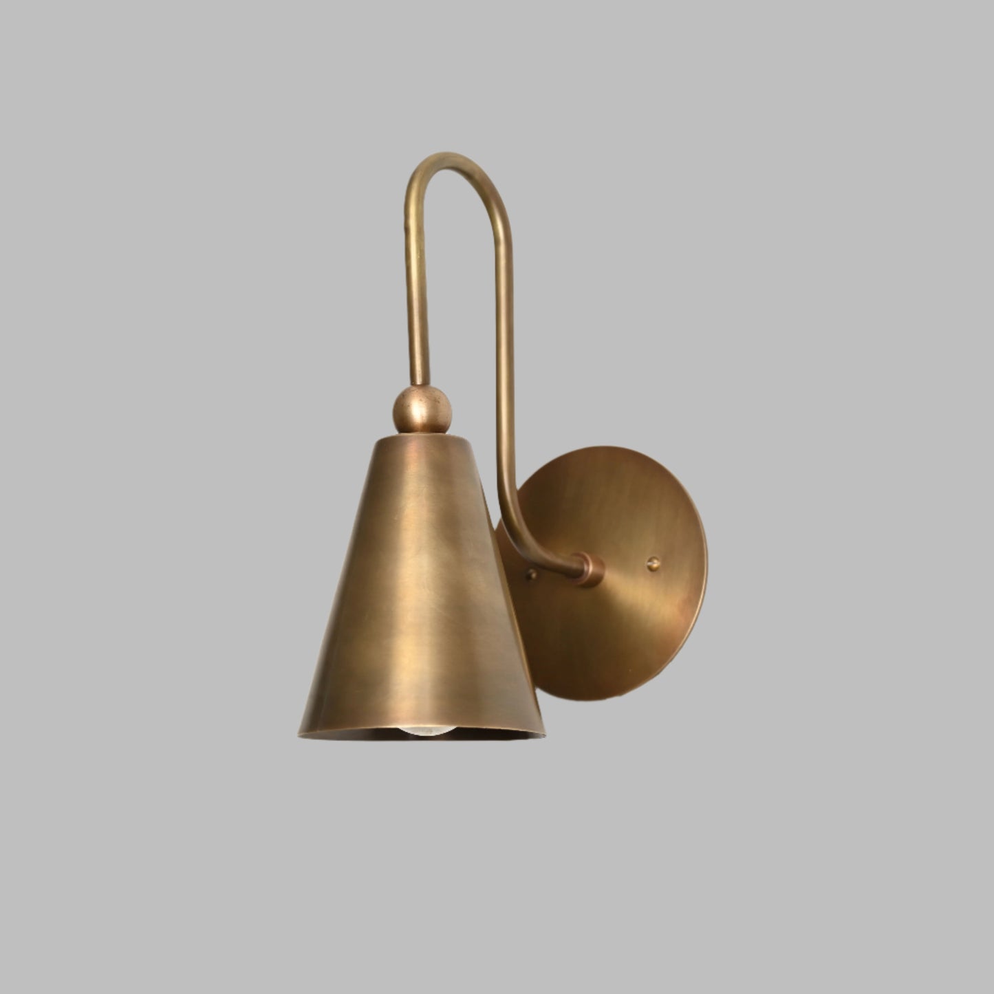 Mid-century modern wall sconces with raw brass finish and Sputnik design, adding style