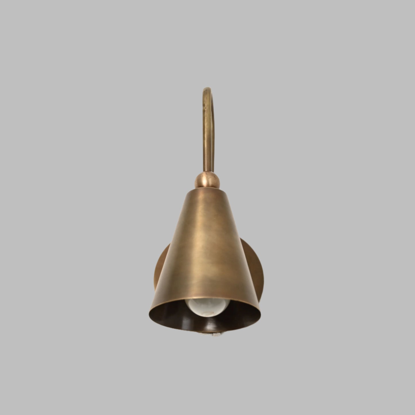 Mid-century modern wall sconces with raw brass finish and Sputnik design, adding style