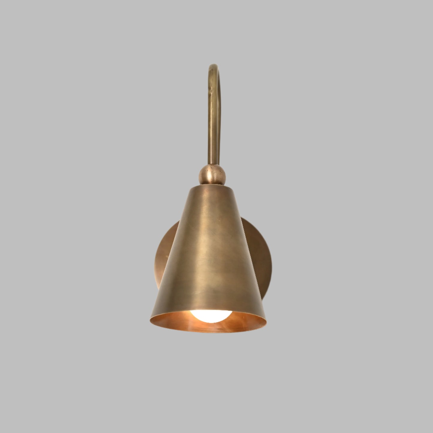 Mid-century modern wall sconces with raw brass finish and Sputnik design, adding style