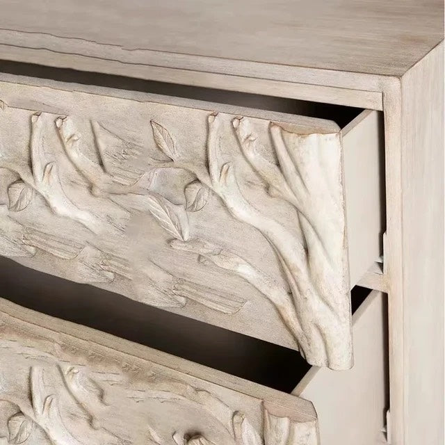 Handcrafted dresser woodland-inspired dresser featuring intricate bird and branch carvings