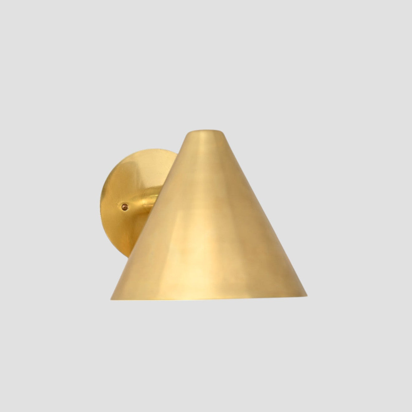 Handmade vintage wall light with a sleek cone shape for timeless, stylish design
