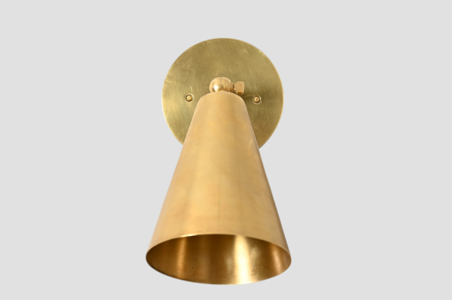Mid-Century Modern Cone Wall Light: Raw brass, radiant glow, sleek timeless design
