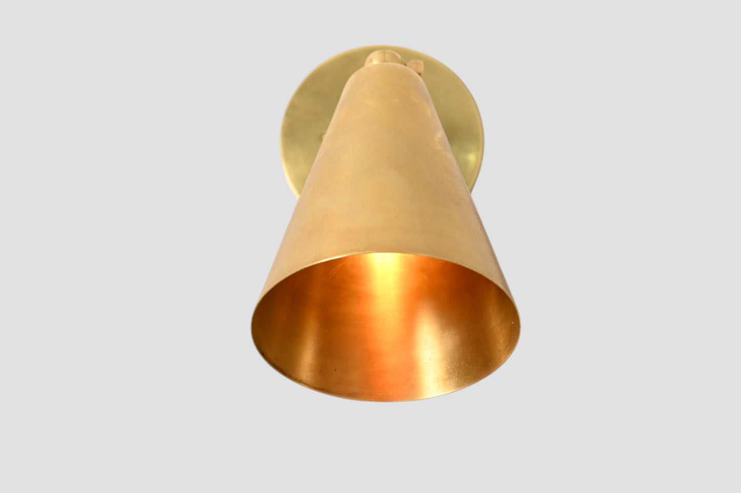 Mid-Century Modern Cone Wall Light: Raw brass, radiant glow, sleek timeless design