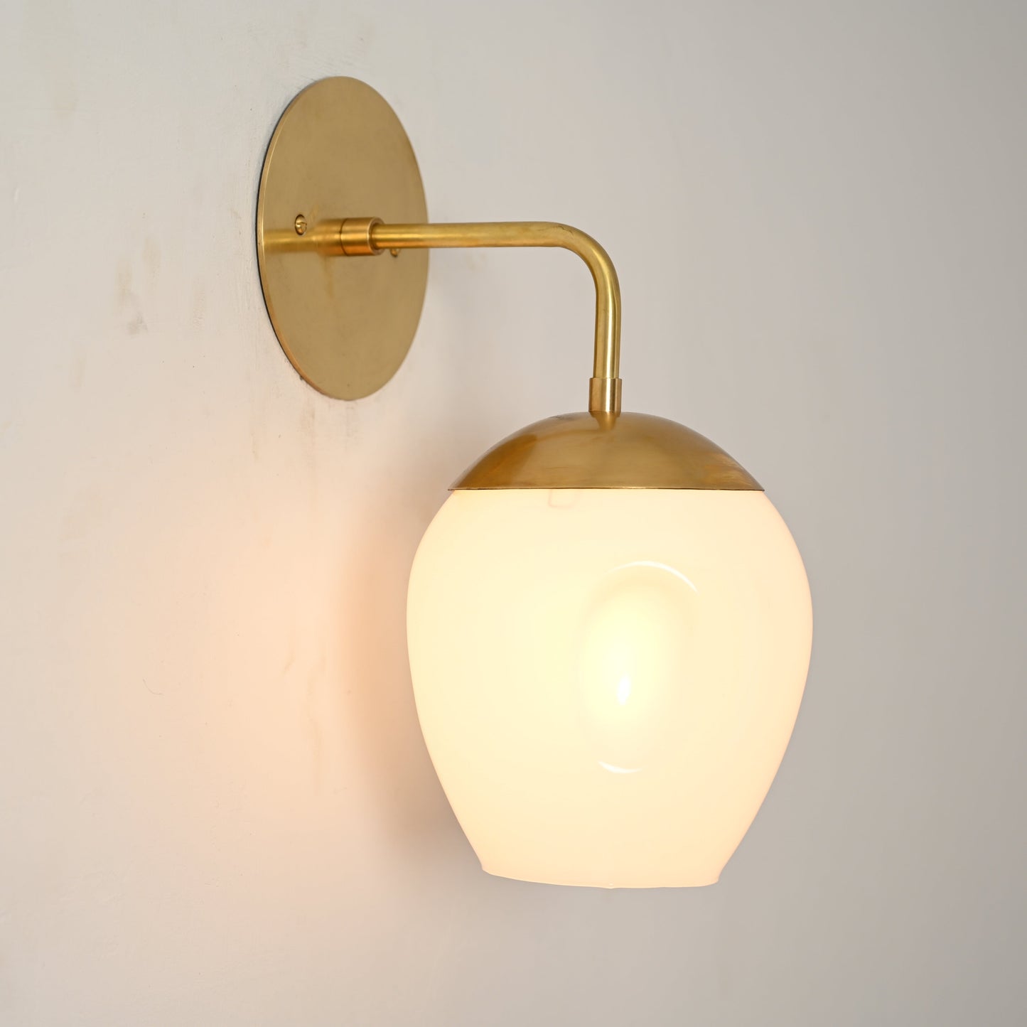 1-Light Dimple Globe Sconce: Raw brass, Mid-Century Modern, sleek stylish lighting accent