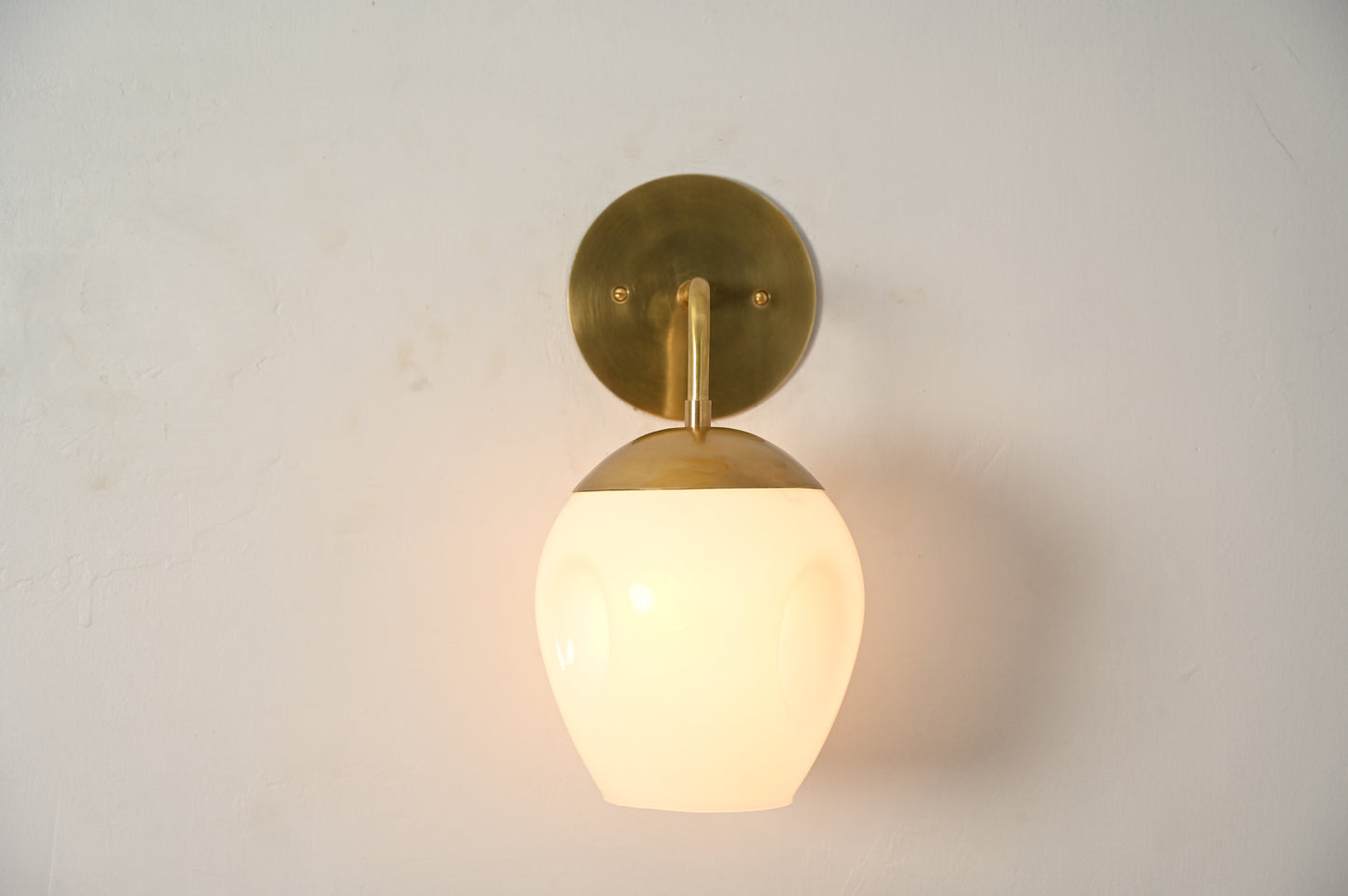 1-Light Dimple Globe Sconce: Raw brass, Mid-Century Modern, sleek stylish lighting accent
