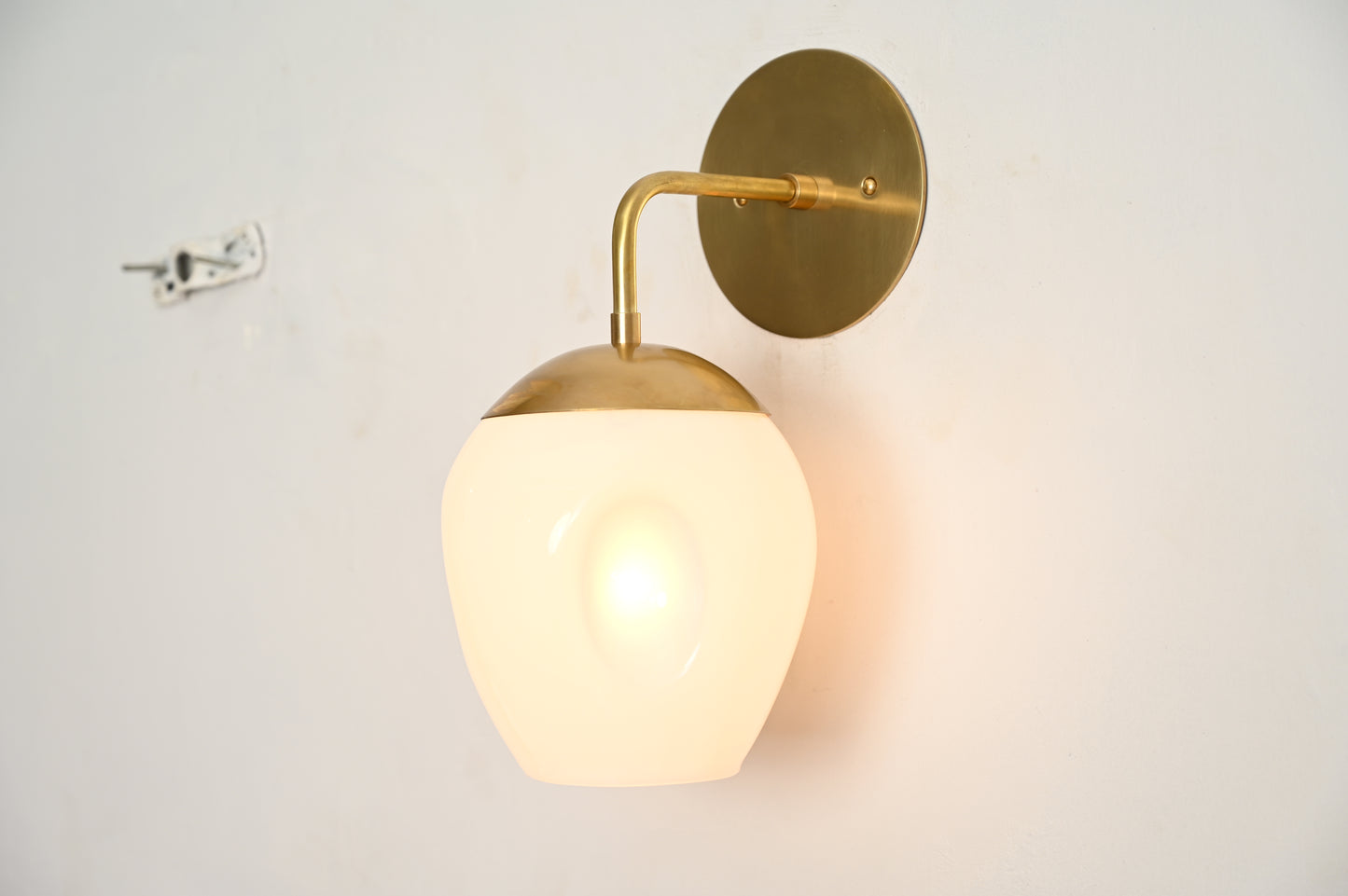 1-Light Dimple Globe Sconce: Raw brass, Mid-Century Modern, sleek stylish lighting accent