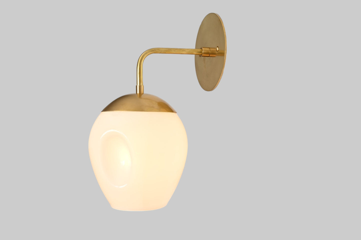 1-Light Dimple Globe Sconce: Raw brass, Mid-Century Modern, sleek stylish lighting accent