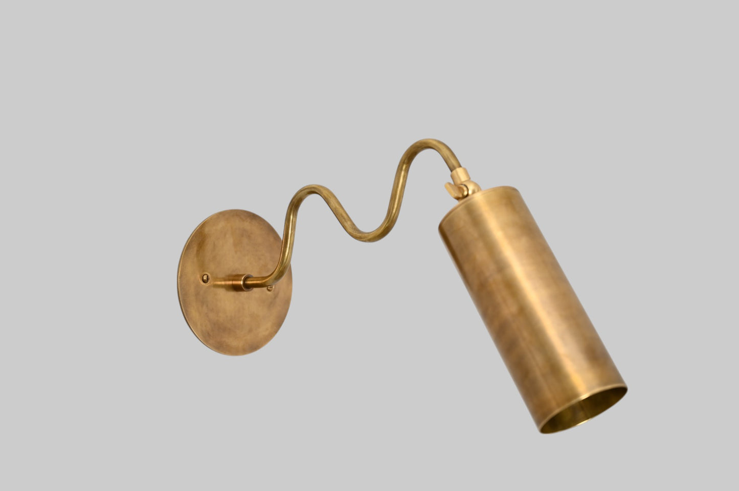 1-Light Italian ZigZag Sconce: Brass, sleek modern design, focused sculptural lighting