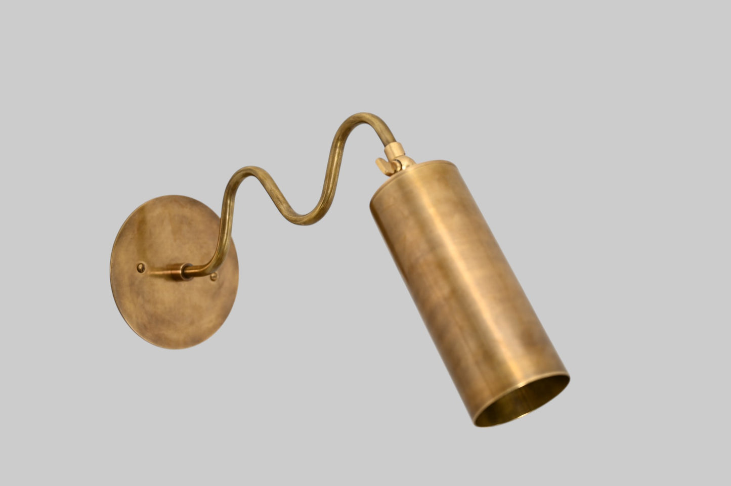 1-Light Italian ZigZag Sconce: Brass, sleek modern design, focused sculptural lighting
