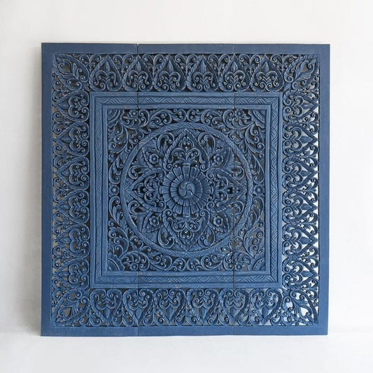 Hand-carved Balinese mandala headboard in a styled bedroom