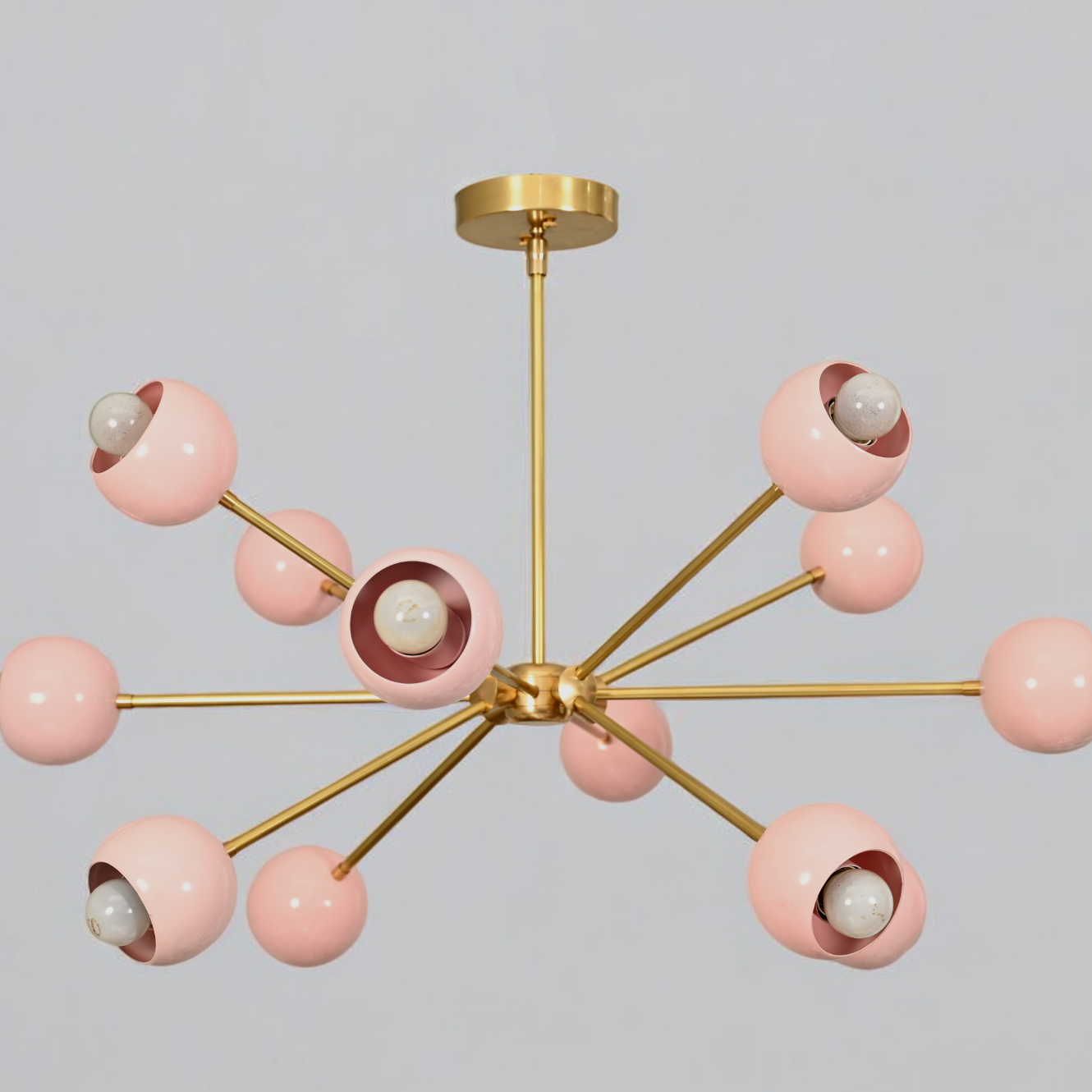 Elegant twelve-arm light pink Sputnik chandelier, a vibrant mid-century starburst fixture.