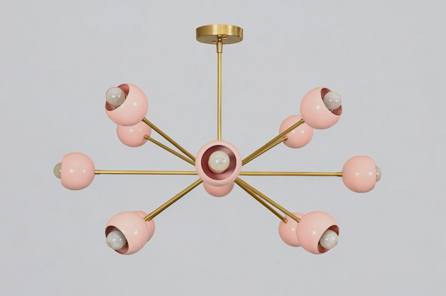 Elegant twelve-arm light pink Sputnik chandelier, a vibrant mid-century starburst fixture.