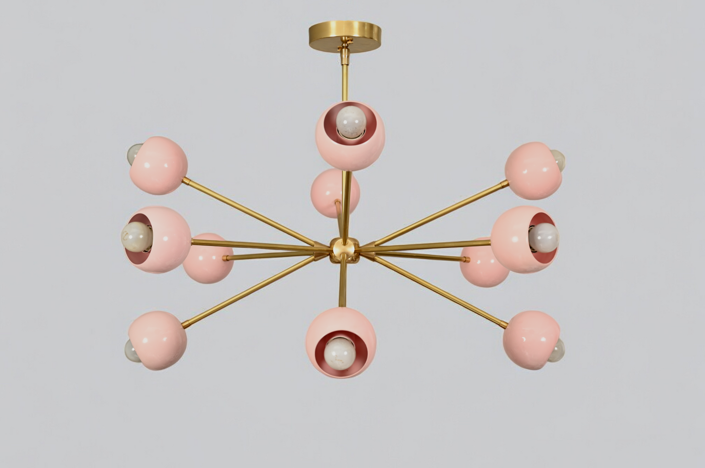 Elegant twelve-arm light pink Sputnik chandelier, a vibrant mid-century starburst fixture.