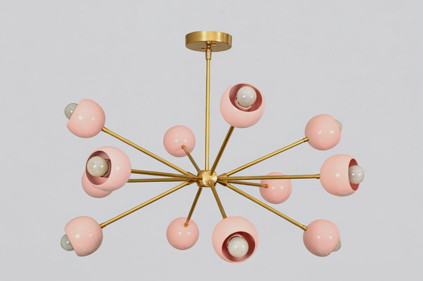 Elegant twelve-arm light pink Sputnik chandelier, a vibrant mid-century starburst fixture.