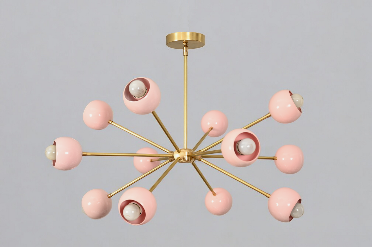 Elegant twelve-arm light pink Sputnik chandelier, a vibrant mid-century starburst fixture.