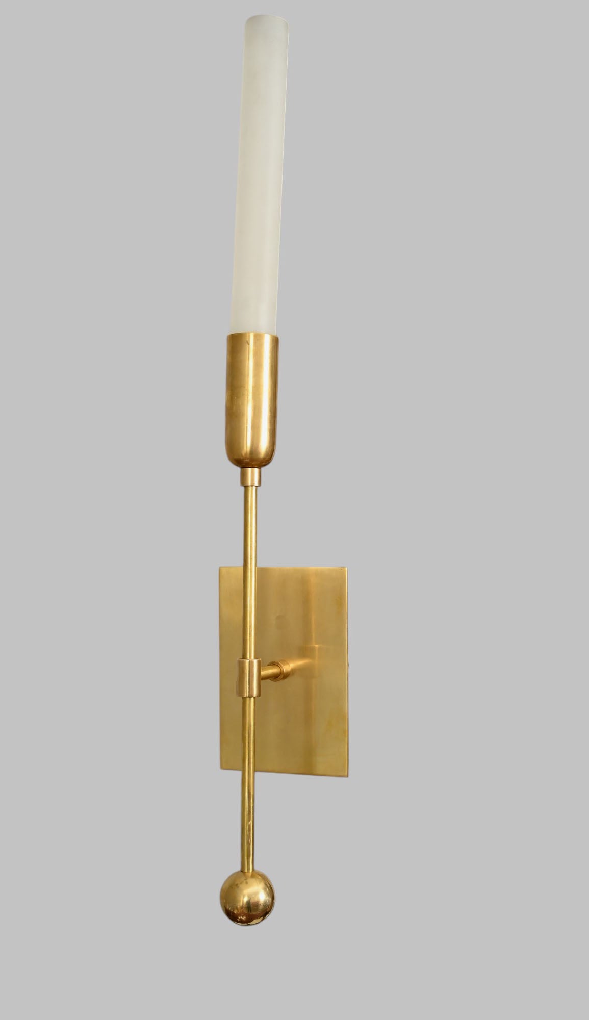 Illuminate your space with the TASSEL 1 Sconce—glass tube with raw brass accents