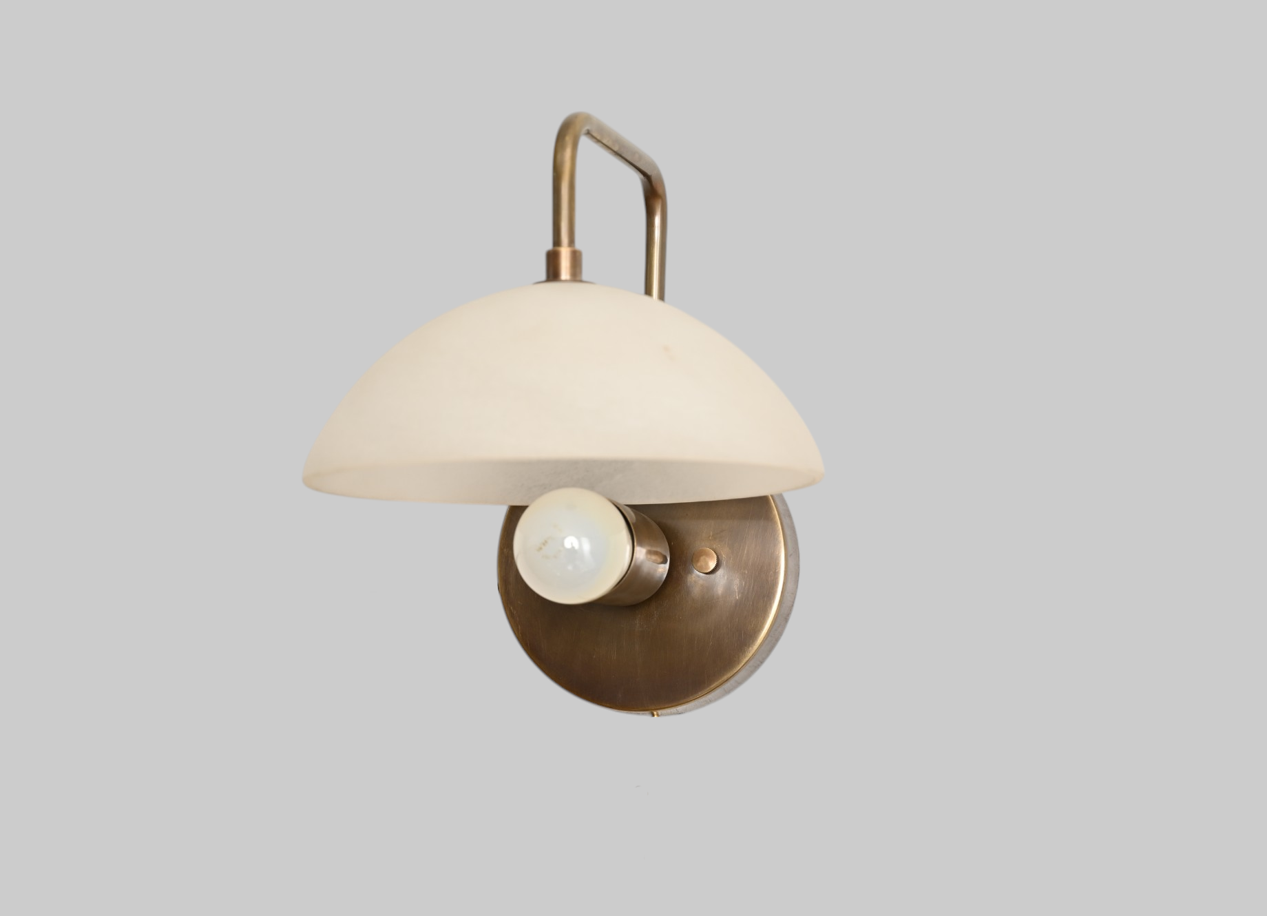 1-light wall fixture with Mid Century Modern Raw Brass Sputnik design, sleek style