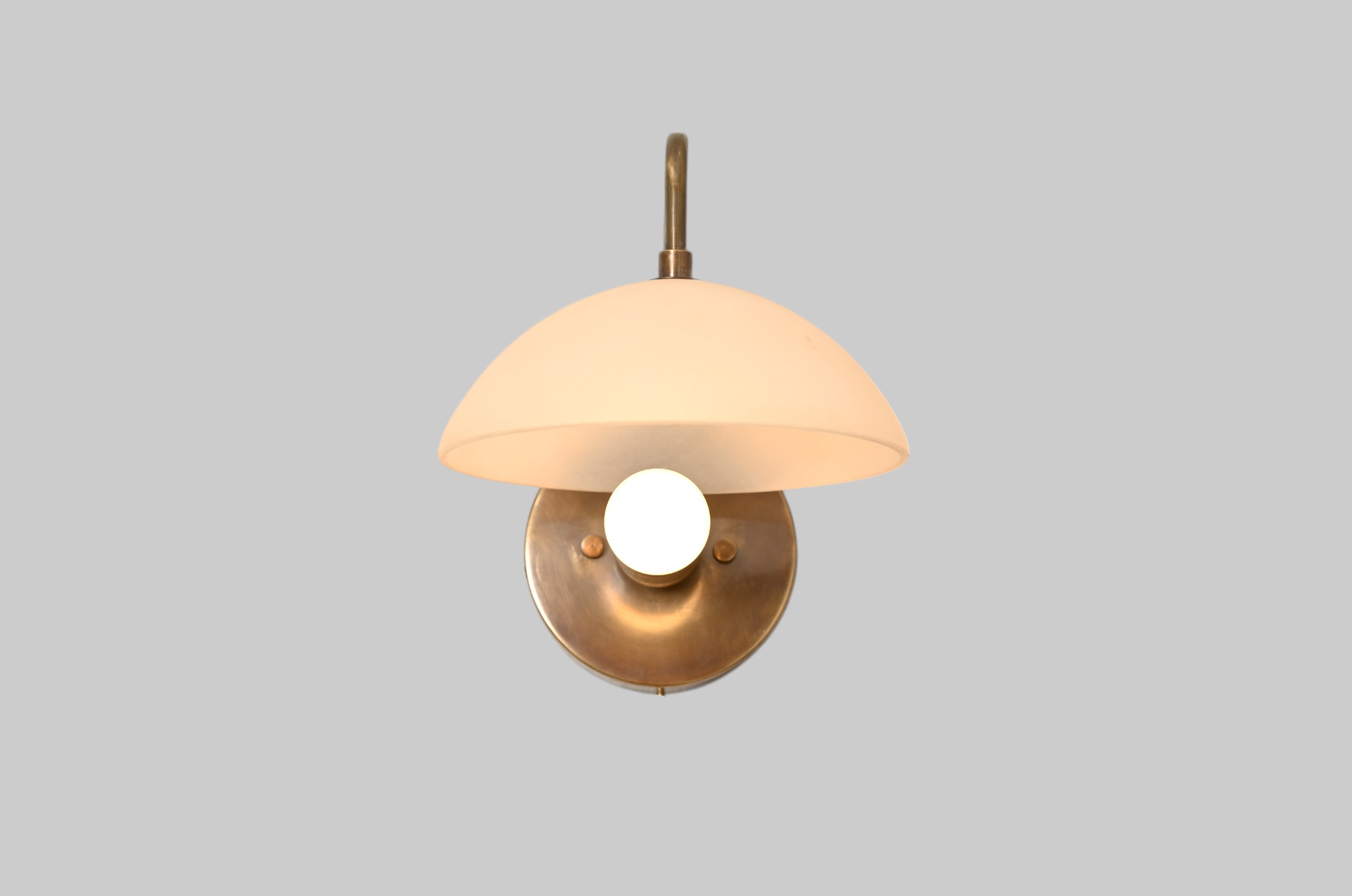 1-light wall fixture with Mid Century Modern Raw Brass Sputnik design, sleek style