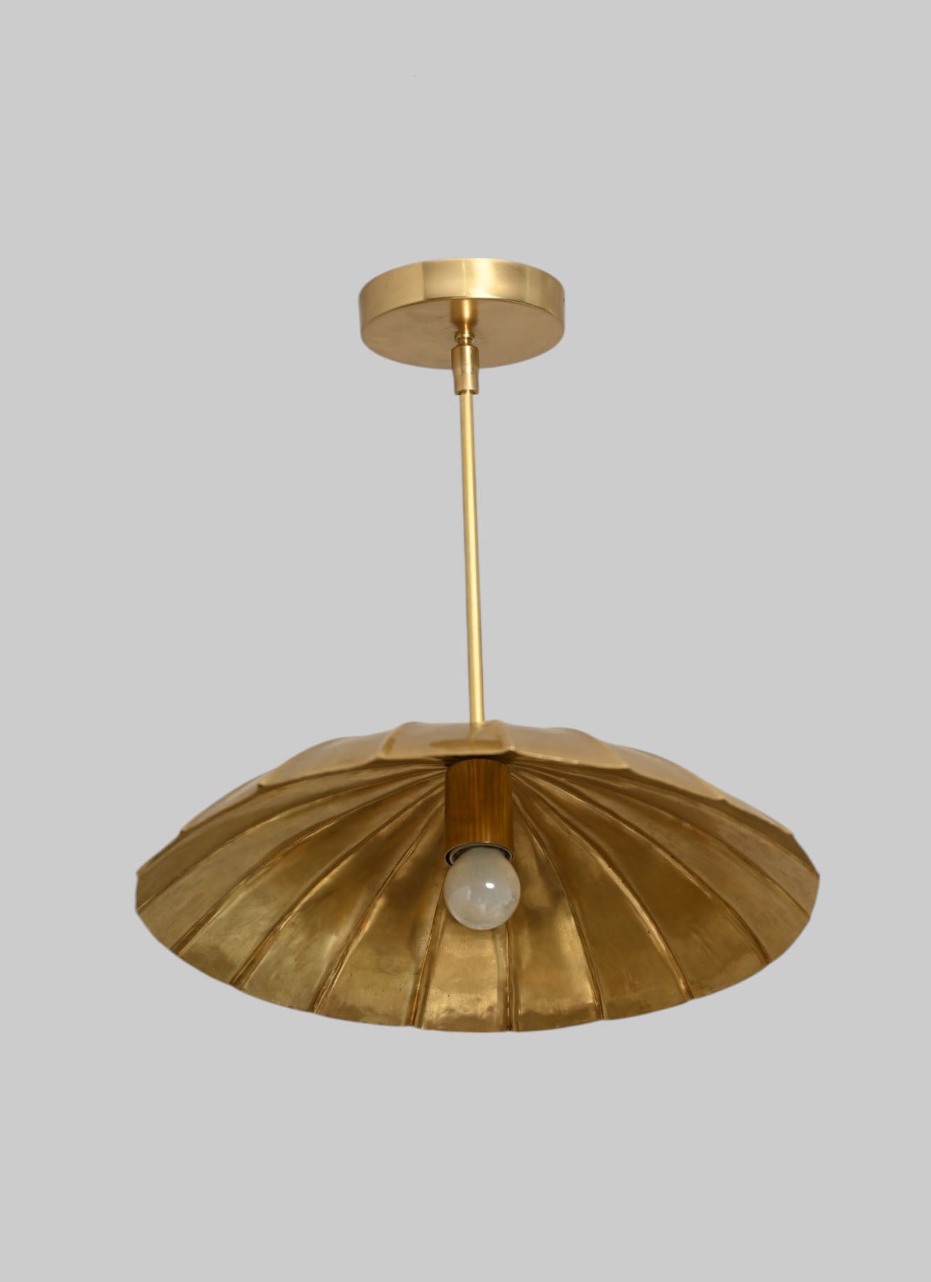 Handcrafted from brass, each chandelier features unique finish variations for a one-of-a-kind look