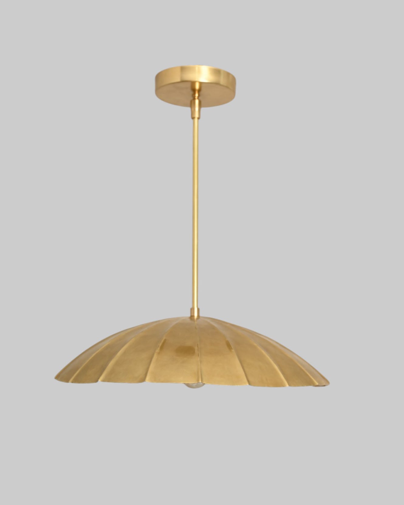 Handcrafted from brass, each chandelier features unique finish variations for a one-of-a-kind look