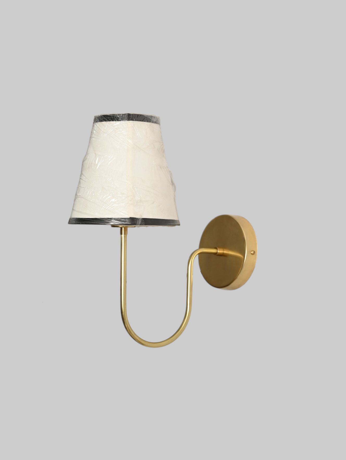 This brass chandelier features natural finish variations, enhancing its unique charm.