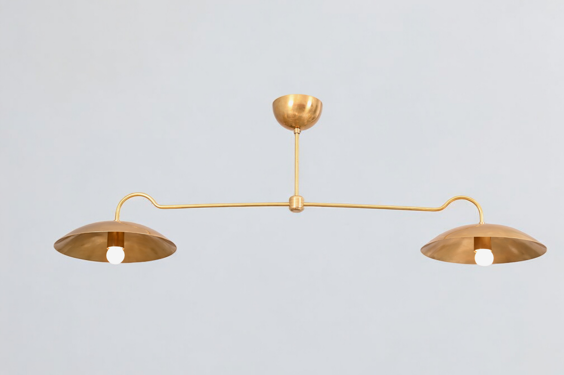 Brighten your space with the Mid Century 2-Light Raw Brass Sputnik Pendant