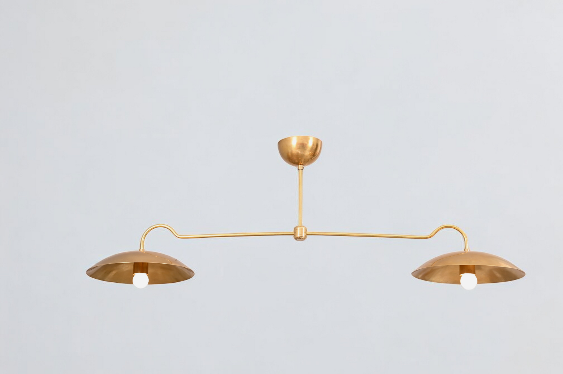 Brighten your space with the Mid Century 2-Light Raw Brass Sputnik Pendant