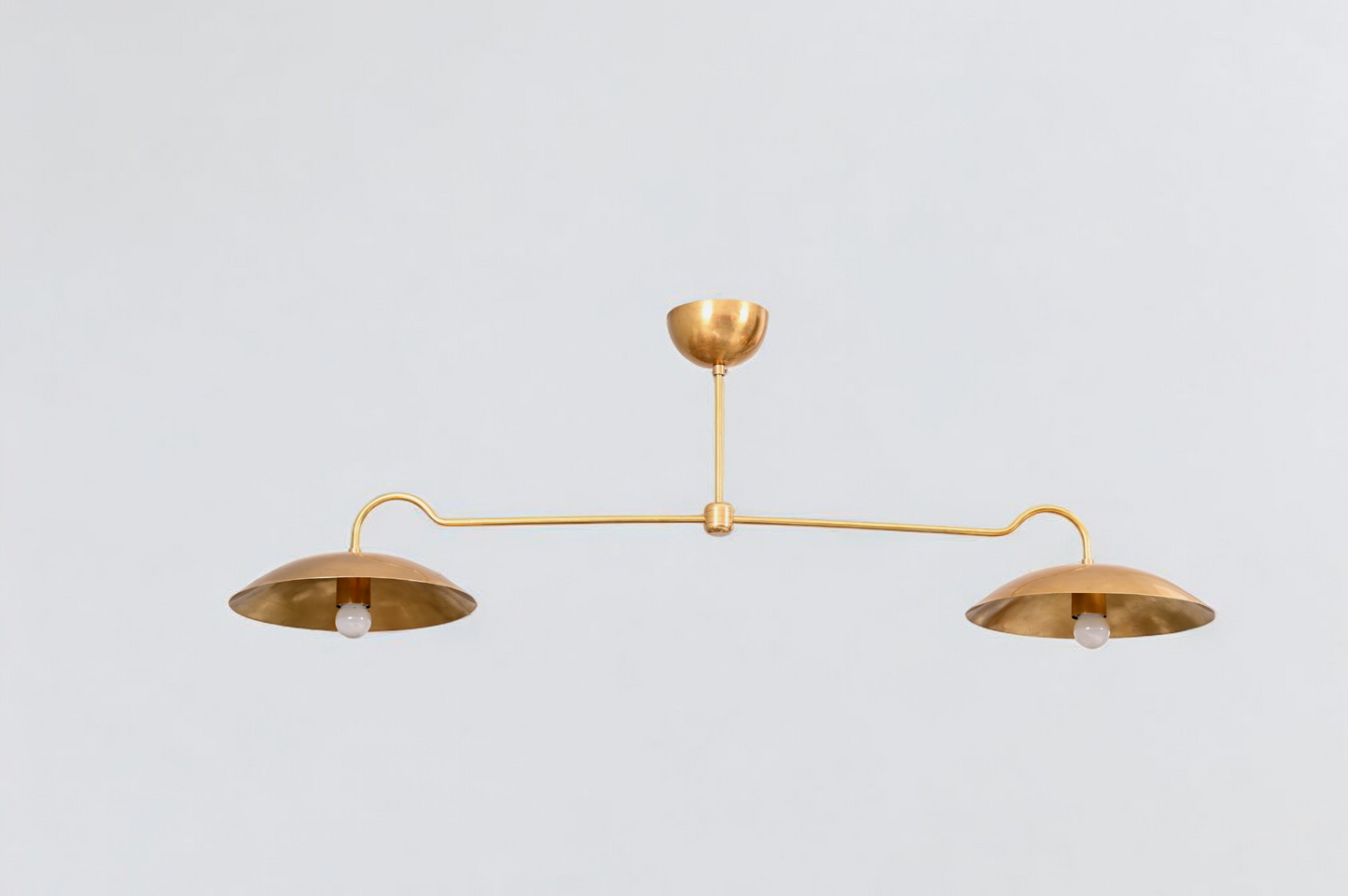 Brighten your space with the Mid Century 2-Light Raw Brass Sputnik Pendant