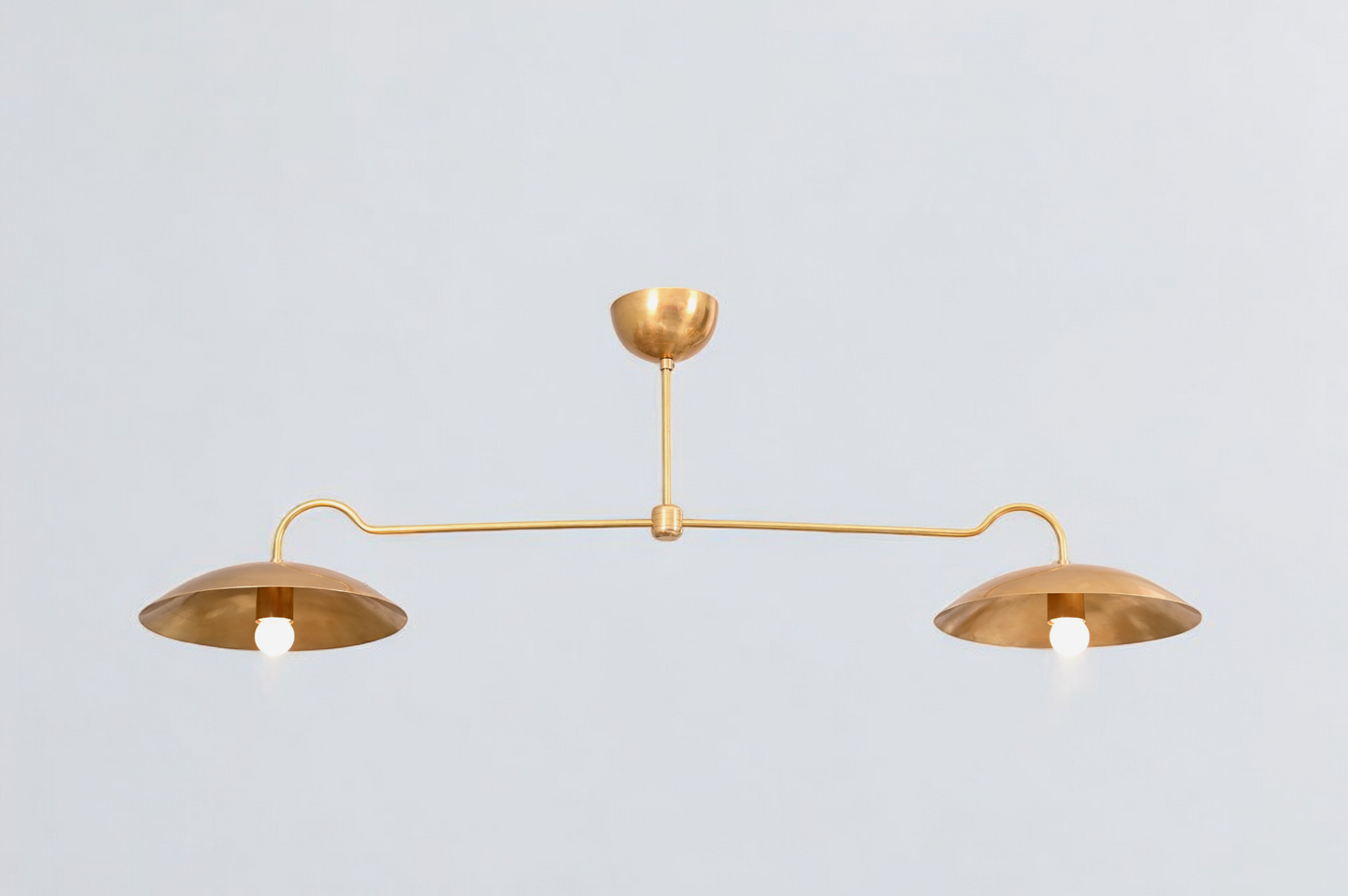 Brighten your space with the Mid Century 2-Light Raw Brass Sputnik Pendant