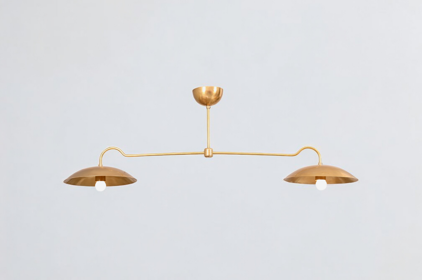 Brighten your space with the Mid Century 2-Light Raw Brass Sputnik Pendant