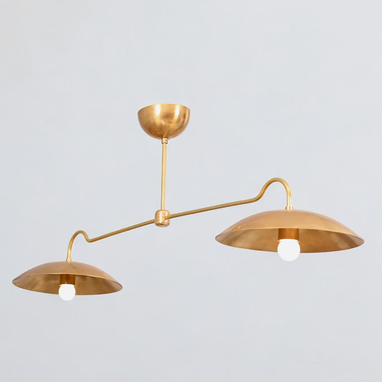 Brighten your space with the Mid Century 2-Light Raw Brass Sputnik Pendant