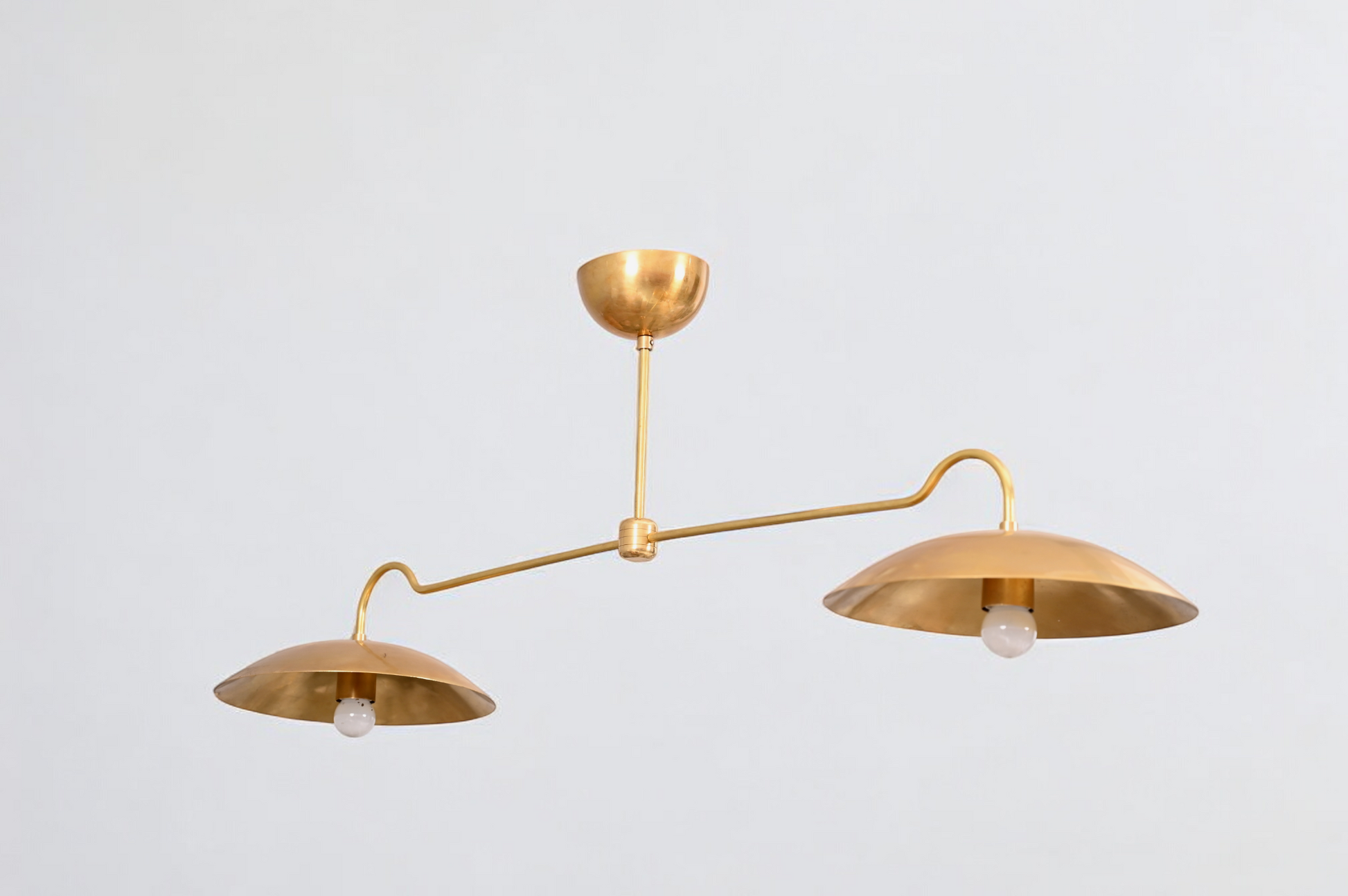 Brighten your space with the Mid Century 2-Light Raw Brass Sputnik Pendant