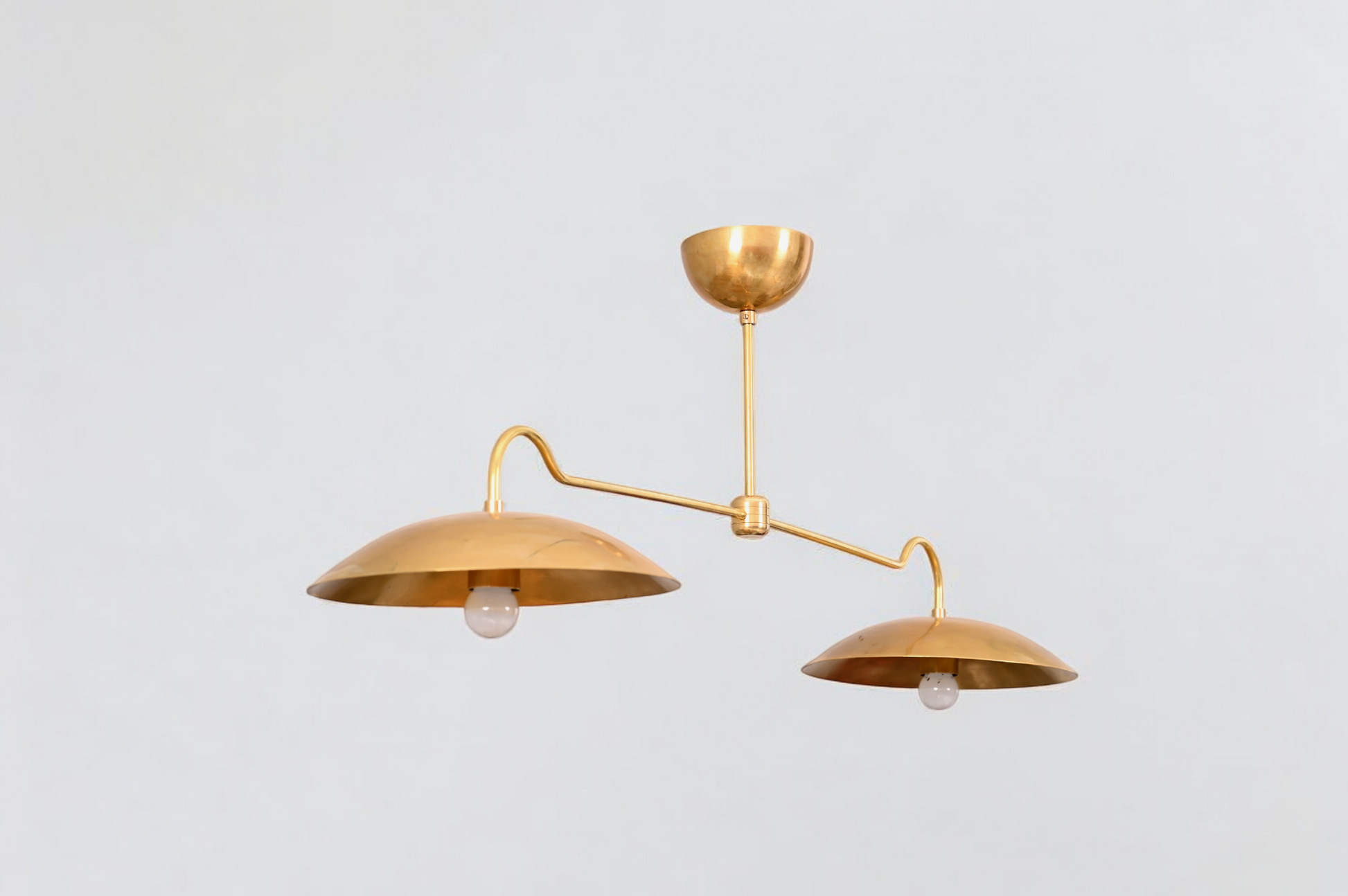 Brighten your space with the Mid Century 2-Light Raw Brass Sputnik Pendant