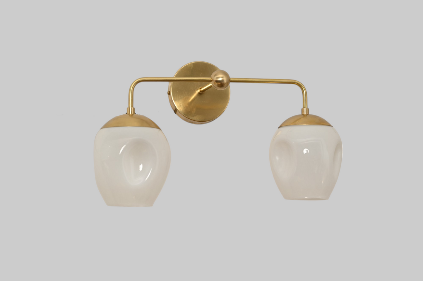2-Light Dimple Globe Sconce: Raw brass, Mid-Century Modern, stylish ambient lighting