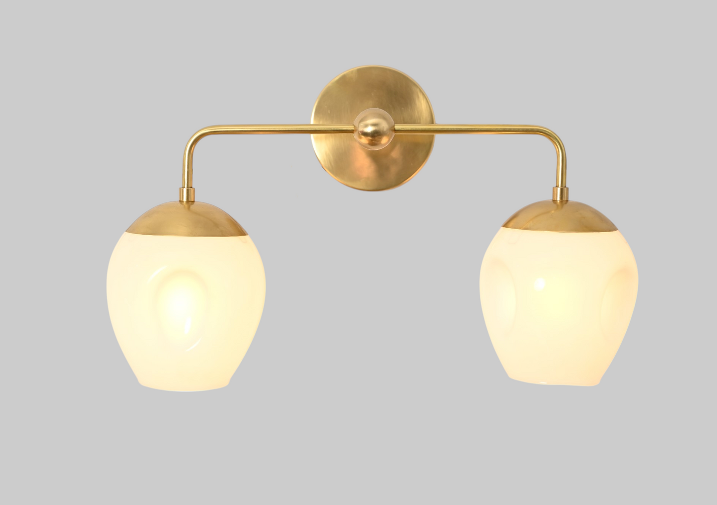 2-Light Dimple Globe Sconce: Raw brass, Mid-Century Modern, stylish ambient lighting